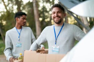 medium-shot-volunteers-carrying-boxes